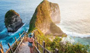 A woman in a swim suit looking at the water