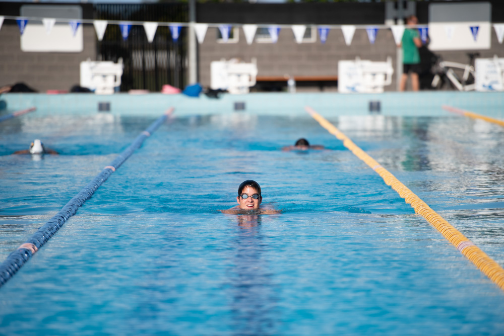 Young man swimming in pool