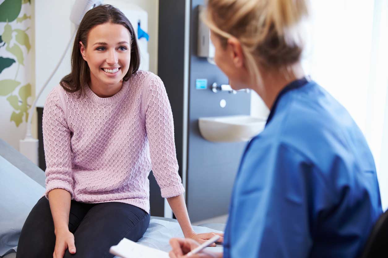 young patient speaking with nurse